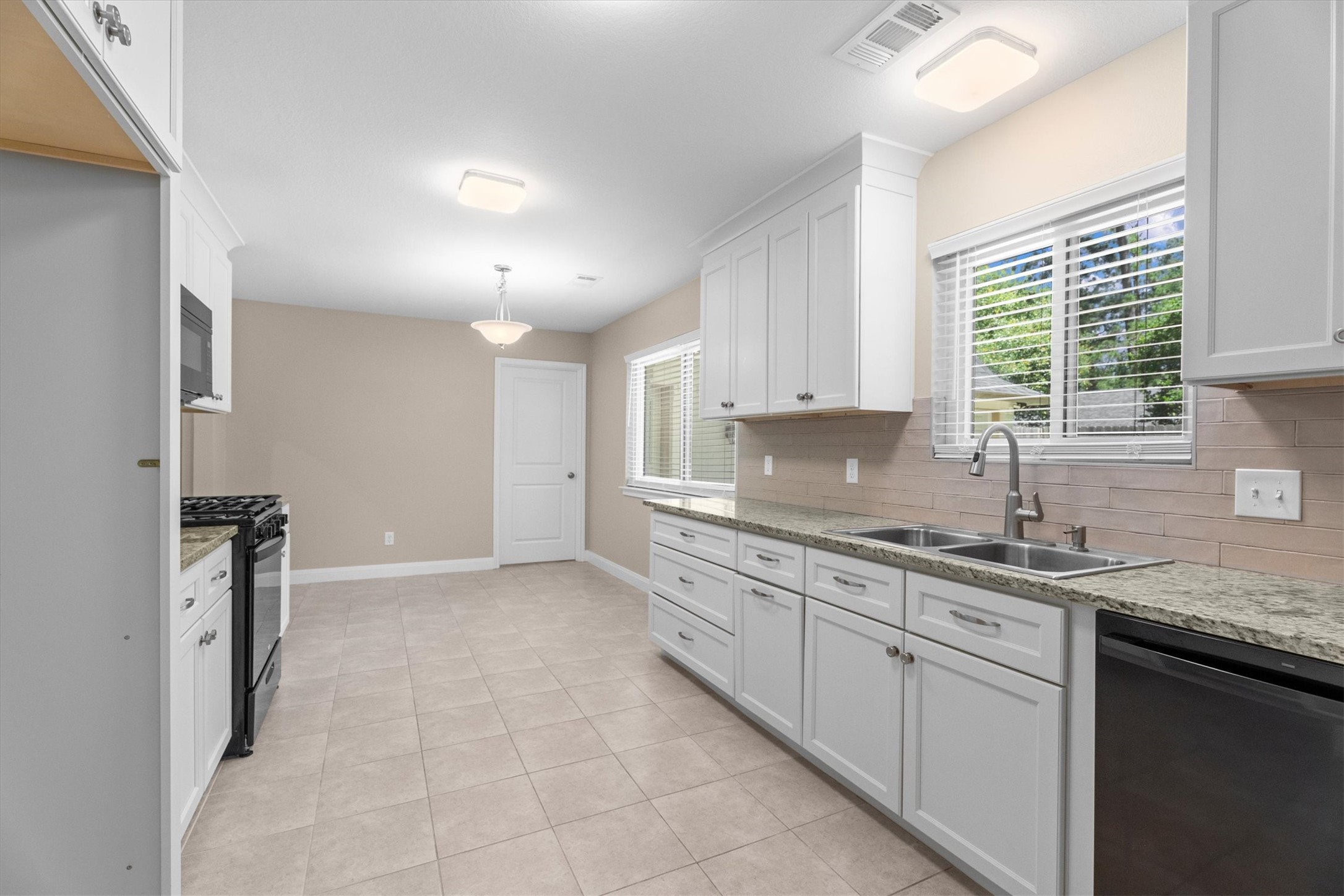 6530 Bayonne Drive Spring, TX 77389 - Photo 15 of 37 a kitchen with a sink cabinets and window