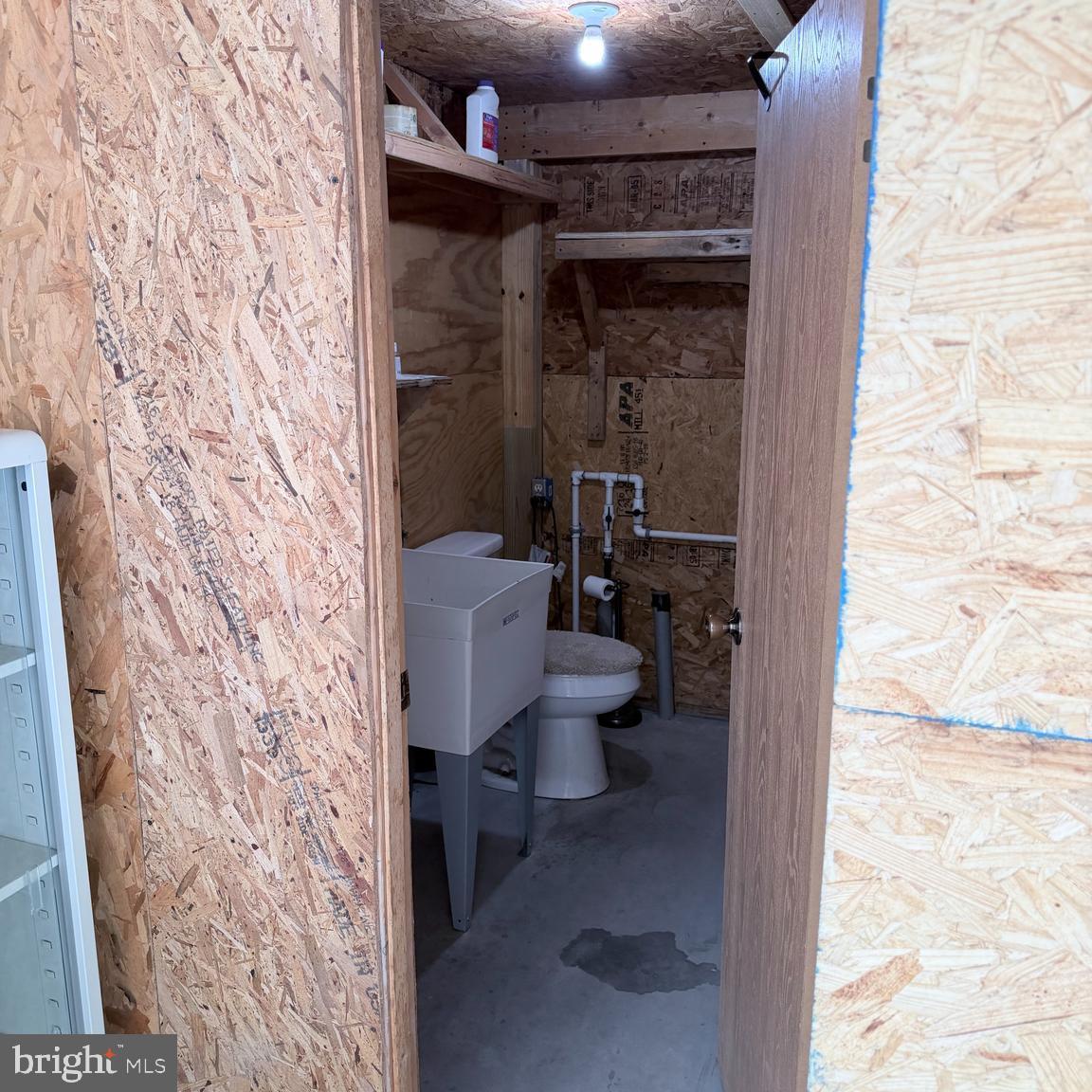 8225 Whitesville Road Pittsville, MD 21850 - Photo 44 of 45 a bathroom with a toilet and a shower curtain
