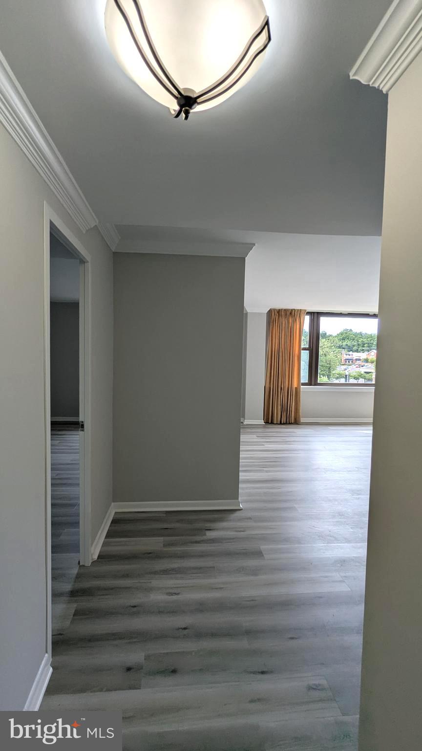 4600 Duke Street, Unit 620 Alexandria, VA 22304 - Photo 7 of 40 a view of wooden floor and window in a room