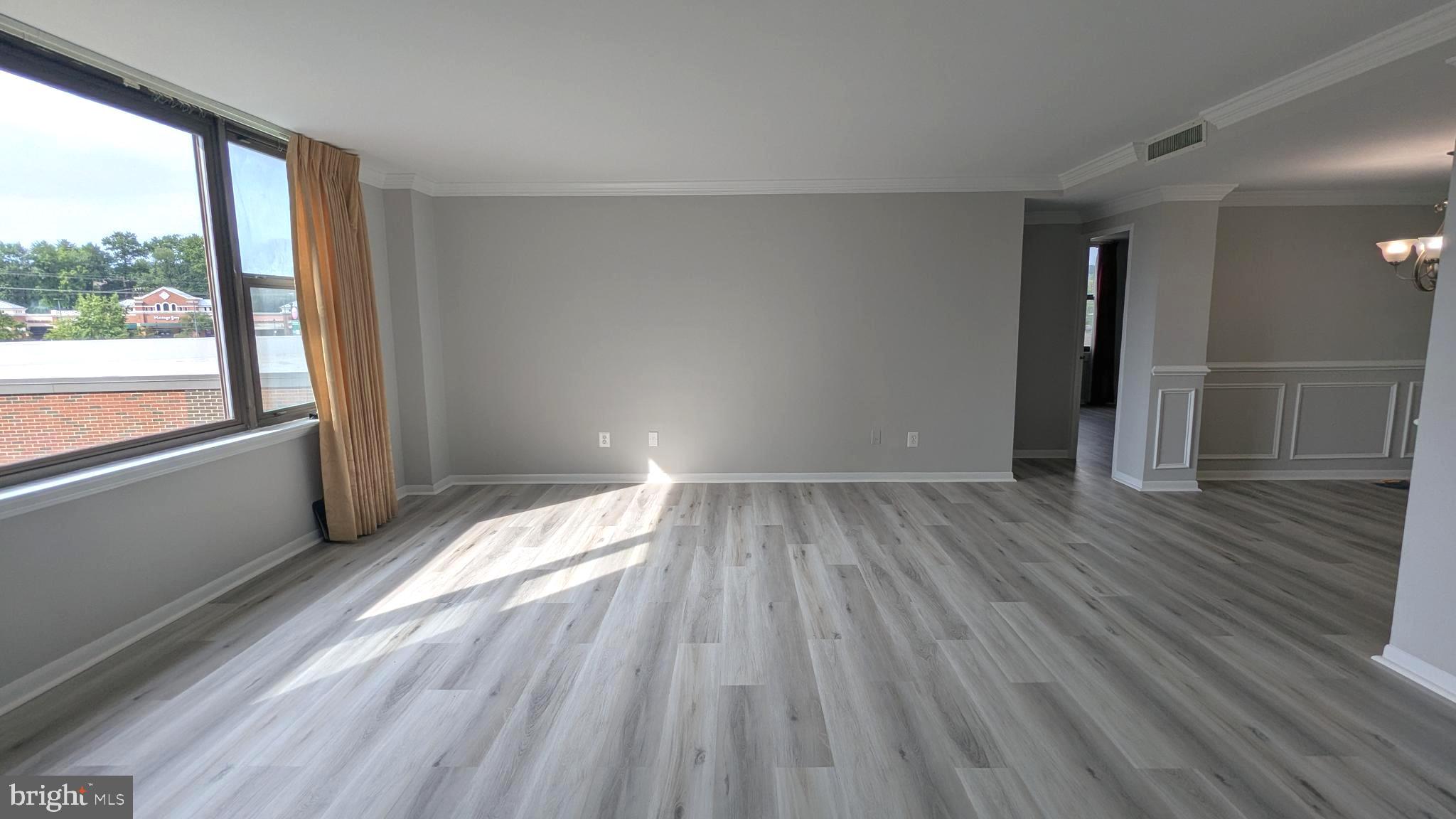 4600 Duke Street, Unit 620 Alexandria, VA 22304 - Photo 9 of 40 wooden floor in an empty room with a window