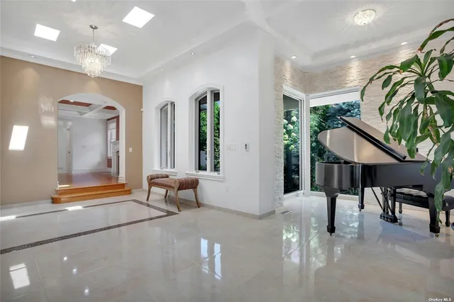 a lobby with furniture and a potted plant