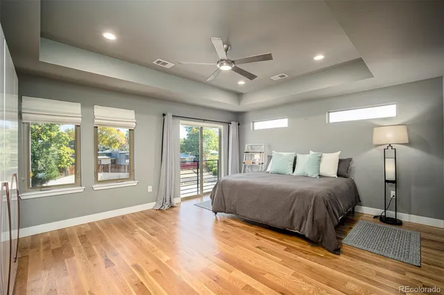 a spacious bedroom with a large bed and a large window