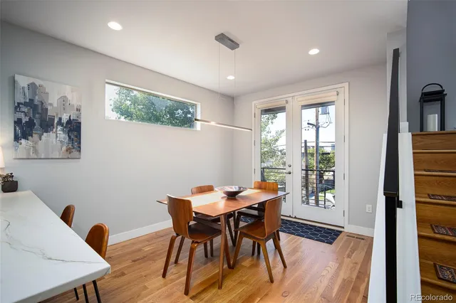 a view of a dining room with furniture window and wooden floor