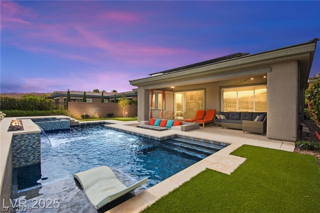 103 Reflection Cove Drive Henderson, NV 89011 - Photo 4 of 66 View of pool featuring a patio area, a fenced backyard, a pool with connected hot tub, and outdoor lounge area