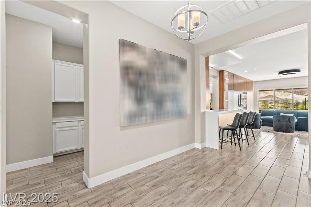 103 Reflection Cove Drive Henderson, NV 89011 - Photo 53 of 66 Dining space with wood tiled floors and baseboards