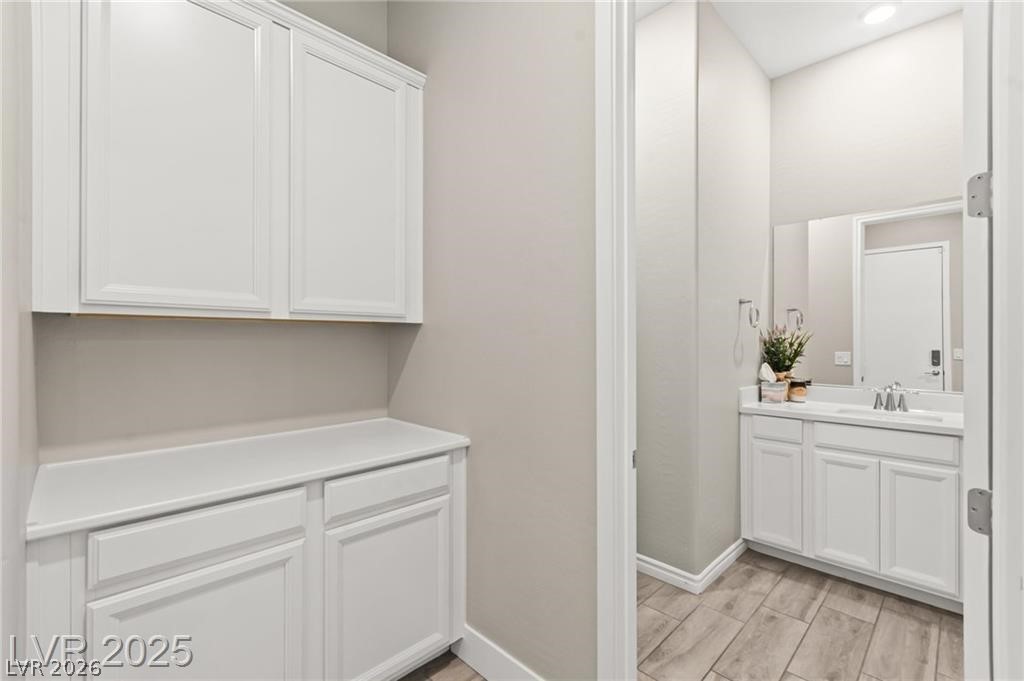 103 Reflection Cove Drive Henderson, NV 89011 - Photo 54 of 66 Bathroom with vanity and wood tiled floors