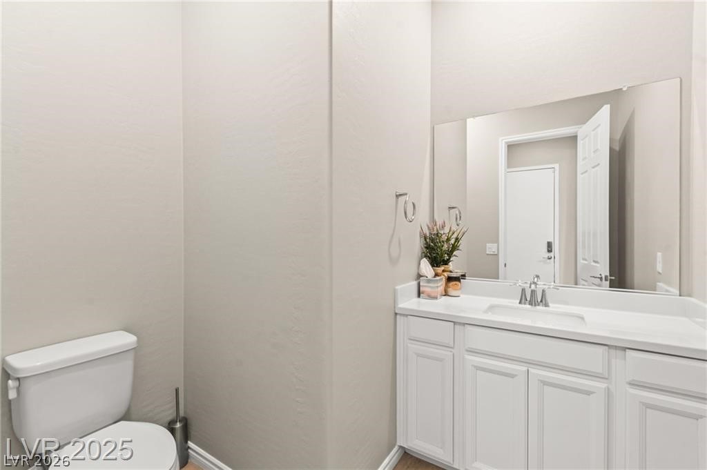 103 Reflection Cove Drive Henderson, NV 89011 - Photo 56 of 66 Bathroom with vanity and toilet