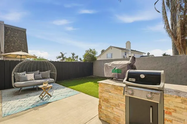 a house view with a backyard space