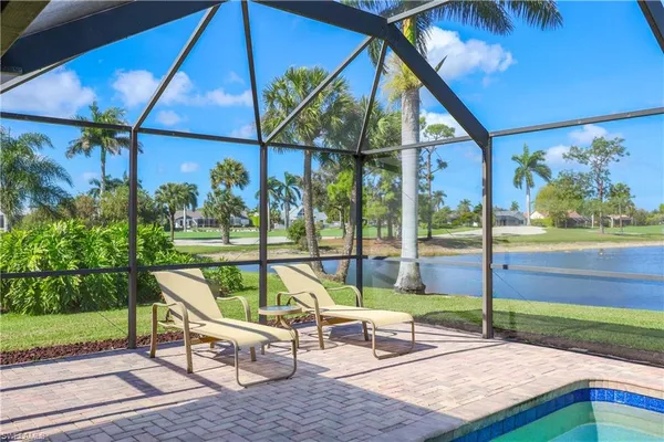 a chair and tables in the yard