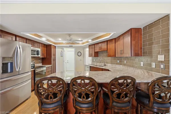 a kitchen with furniture and a sink