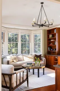 a front view of a house with a yard swimming pool and outdoor seating