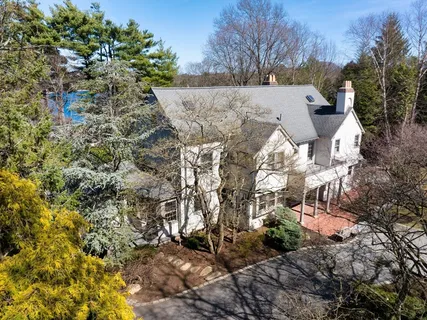 a view of a dining room with furniture and window