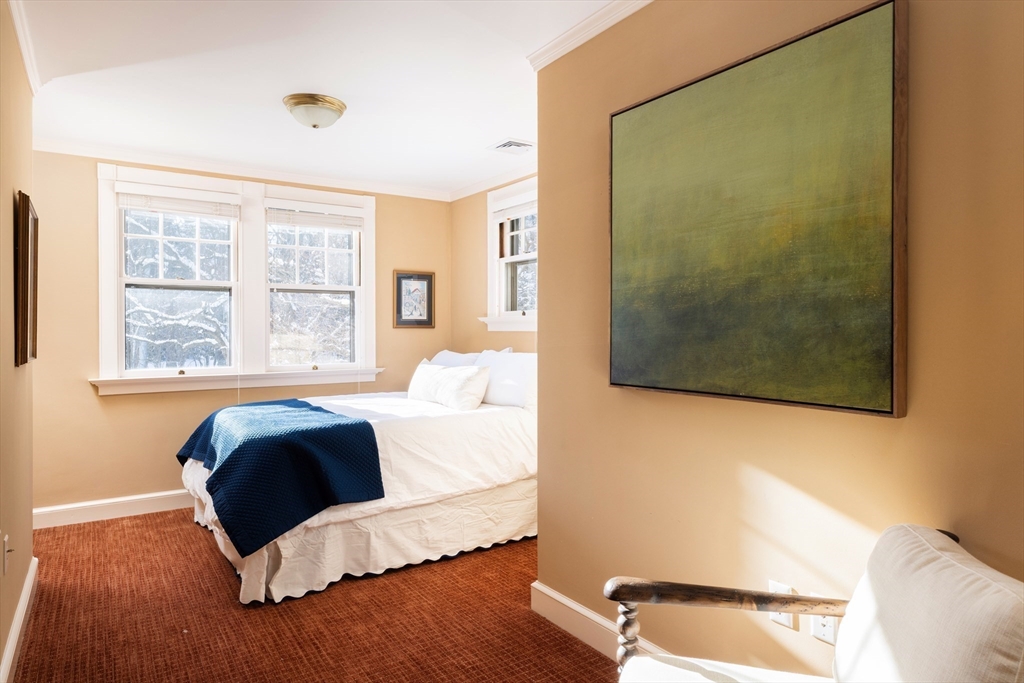 40 Heath Hill Brookline, MA 02445 - Photo 26 of 40 a bedroom with a bed and wooden floor
