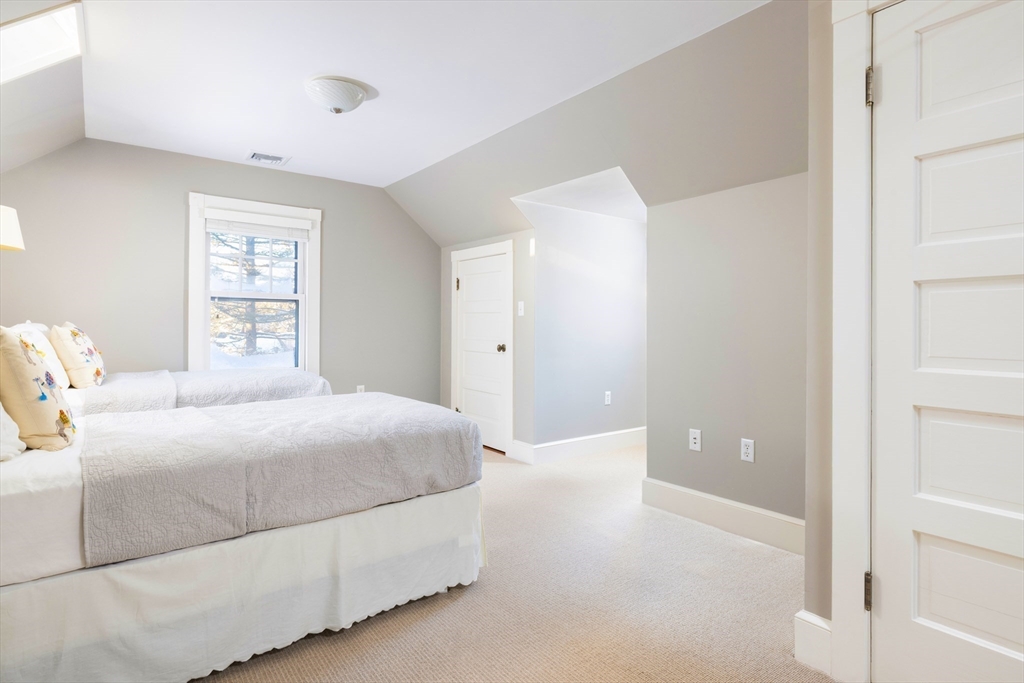 40 Heath Hill Brookline, MA 02445 - Photo 28 of 40 a bedroom with a bed and a window