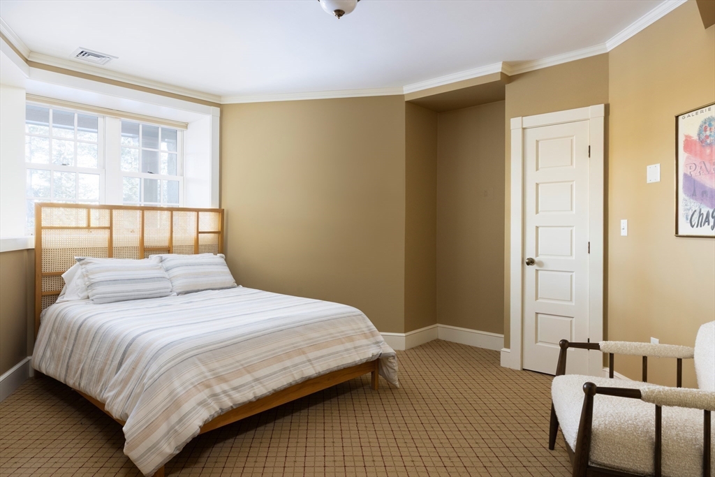 40 Heath Hill Brookline, MA 02445 - Photo 33 of 40 a bedroom with a bed and with chair