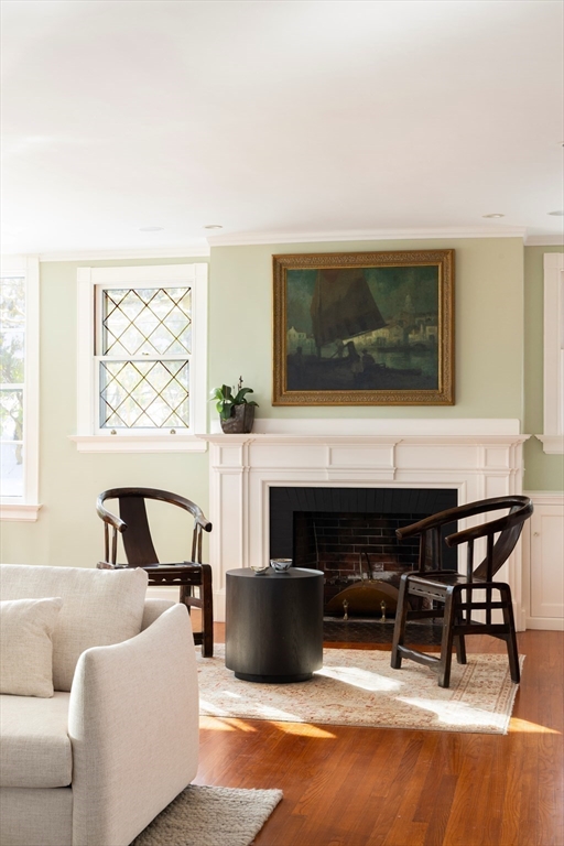 40 Heath Hill Brookline, MA 02445 - Photo 5 of 40 a living room with furniture a fireplace and a flat screen tv