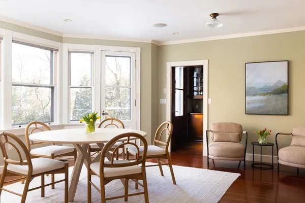 a dining room with furniture window and outside view