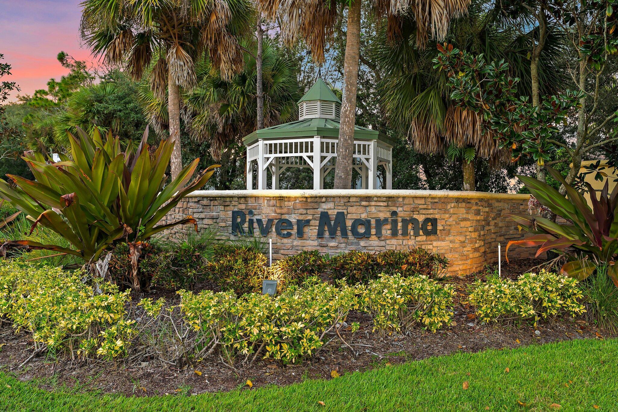 2912 Southwest Porpoise Circle Stuart, FL 34997 - Photo 23 of 36 a front view of a house with a yard