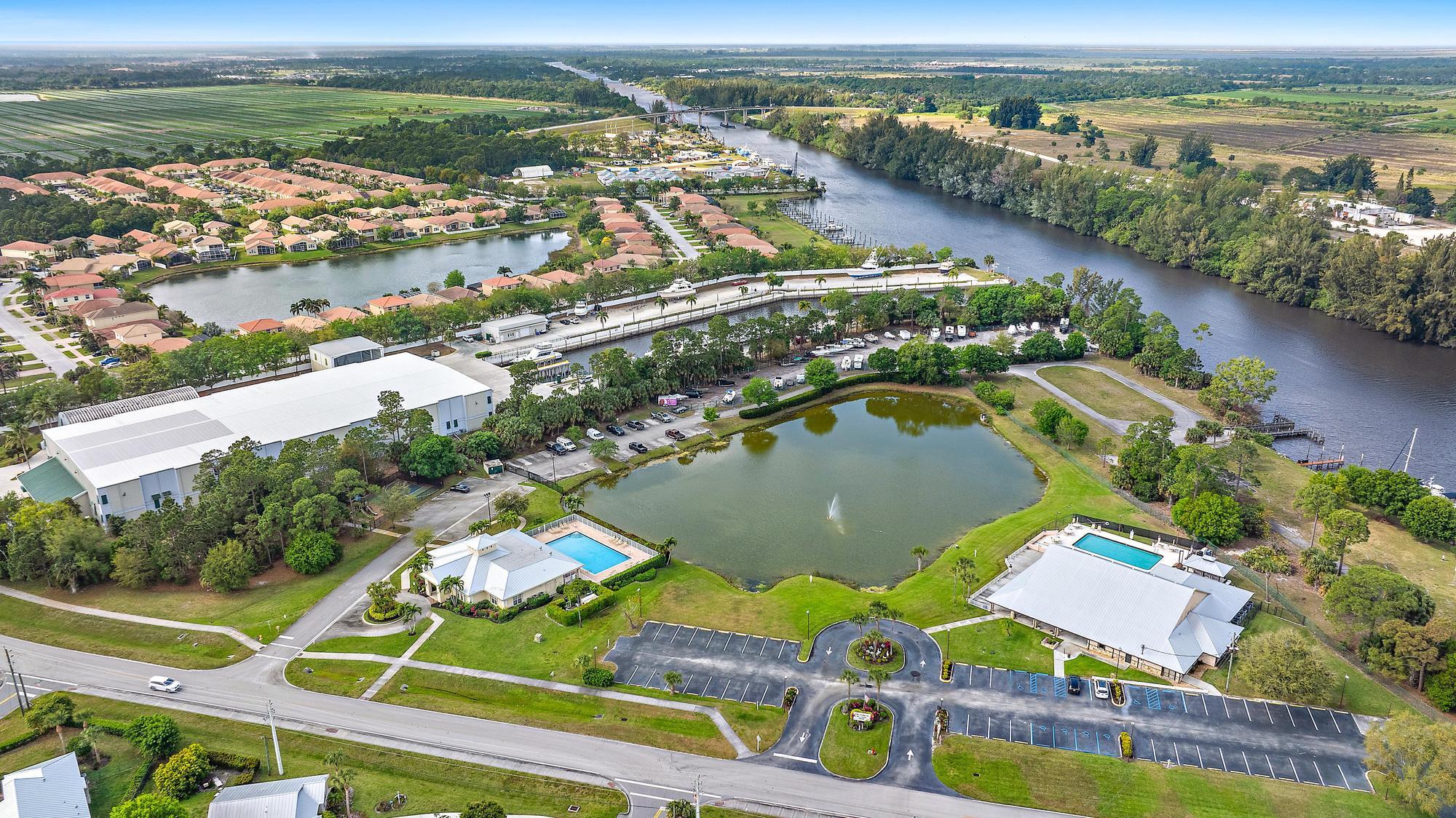 2912 Southwest Porpoise Circle Stuart, FL 34997 - Photo 28 of 36 an aerial view of residential houses with outdoor space