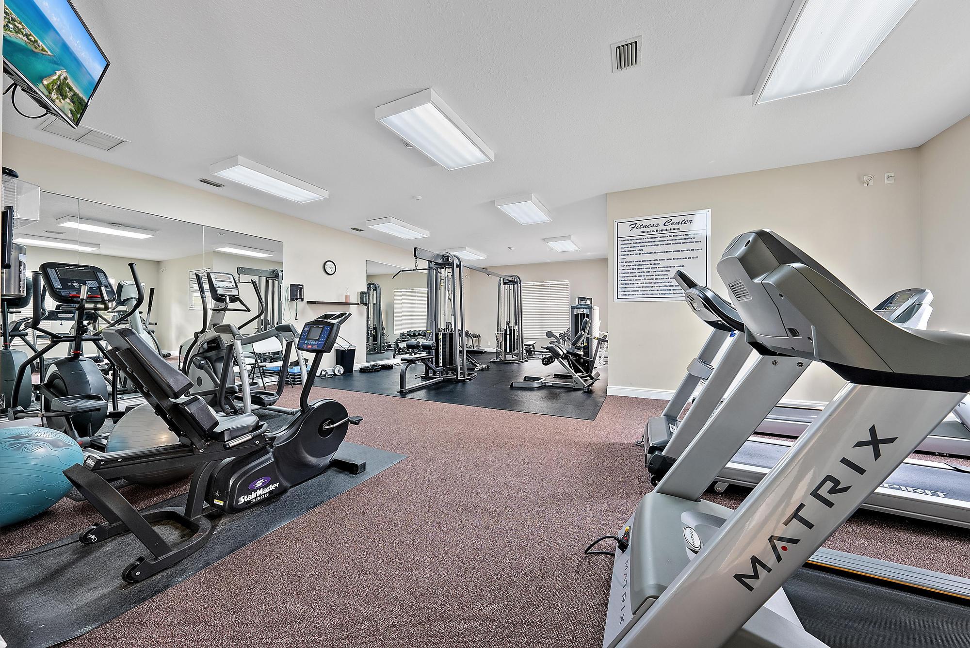 2912 Southwest Porpoise Circle Stuart, FL 34997 - Photo 31 of 36 a view of a room with gym equipment