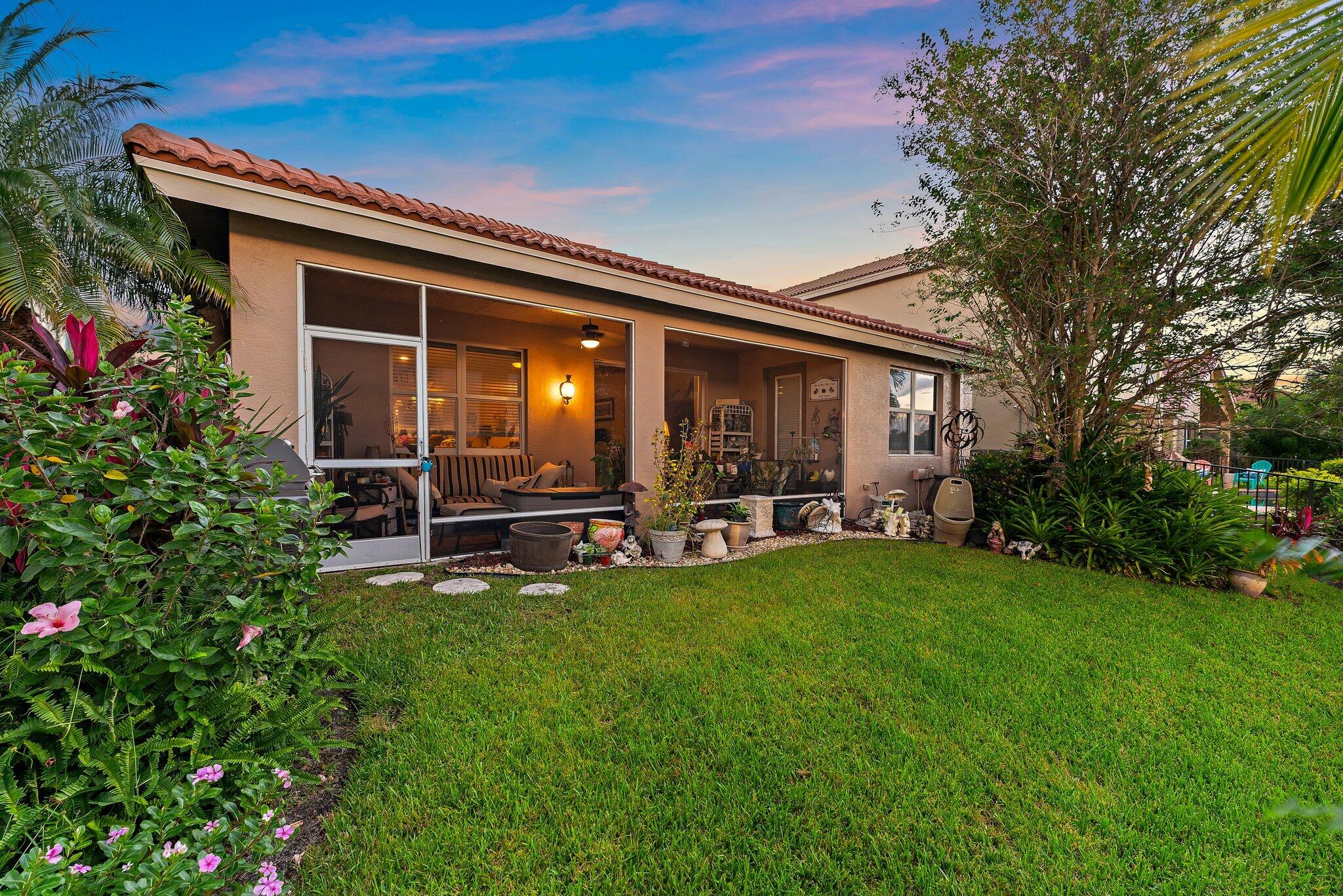 2912 Southwest Porpoise Circle Stuart, FL 34997 - Photo 4 of 36 a view of a house with backyard porch and sitting area