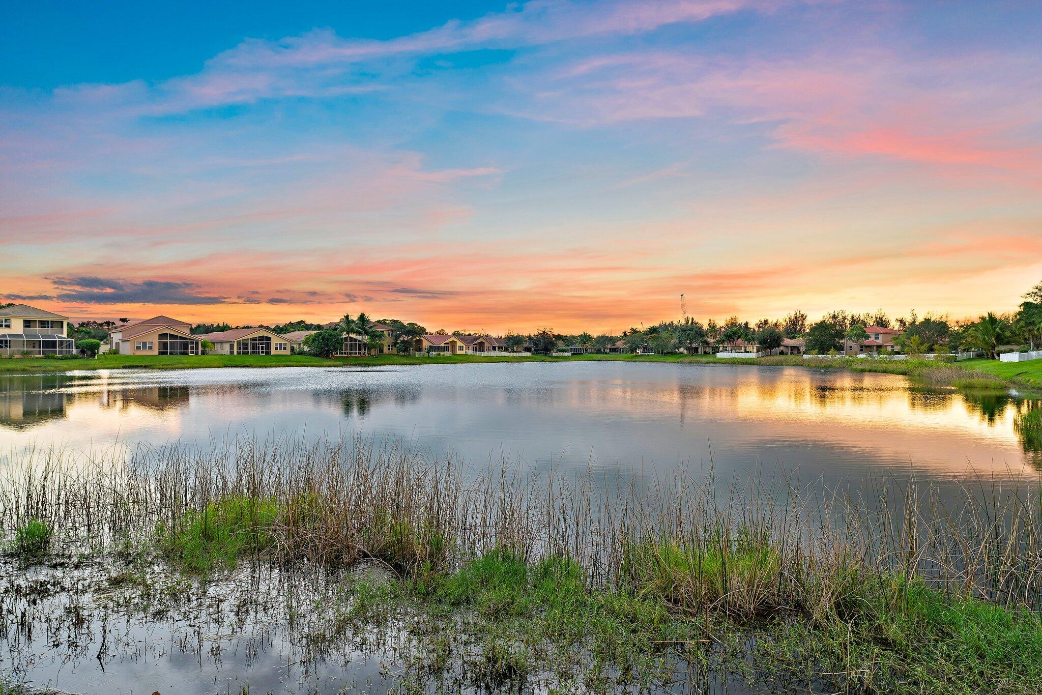 2912 Southwest Porpoise Circle Stuart, FL 34997 - Photo 7 of 36 a view of a lake from a yard