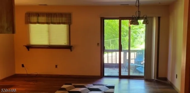 a room with window and wooden floor