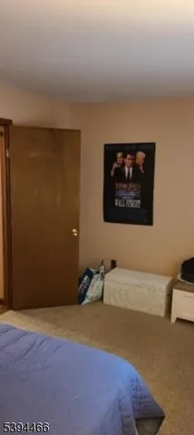 a view of a livingroom with furniture and screen