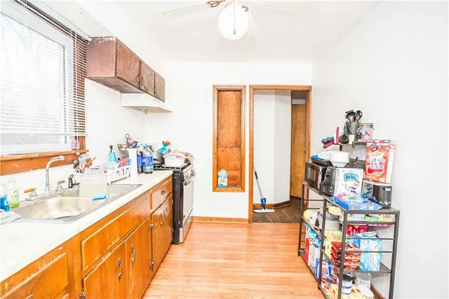 a kitchen with refrigerator and window