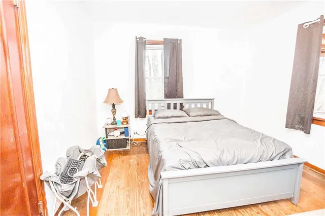 a bedroom with a bed and couch