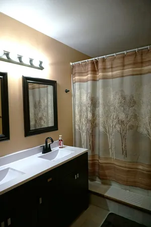 a bathroom with a sink and a mirror