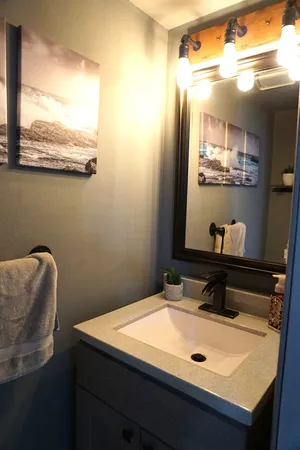 a bathroom with a sink and a mirror