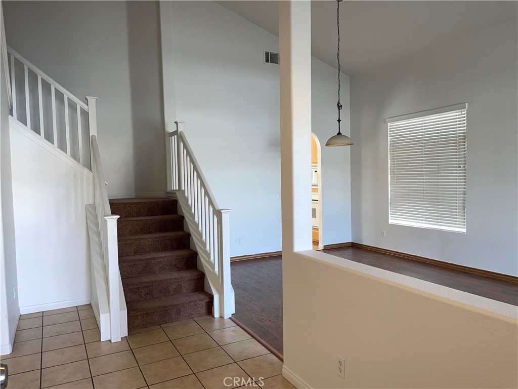 12661 Luna Road Victorville, CA 92392 - Photo 2 of 20 a view of an entryway with staircase