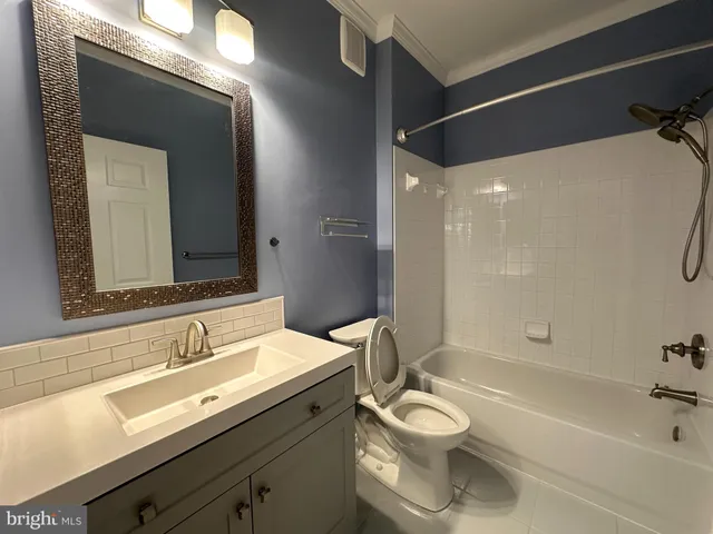 a bathroom with a toilet a sink and bathtub