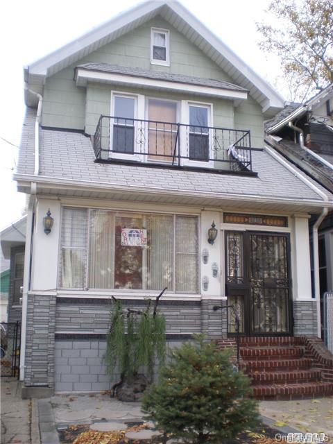 91-10 97th Street, Unit 2 Queens, NY 11421 - Photo 1 of 1 front view of a house