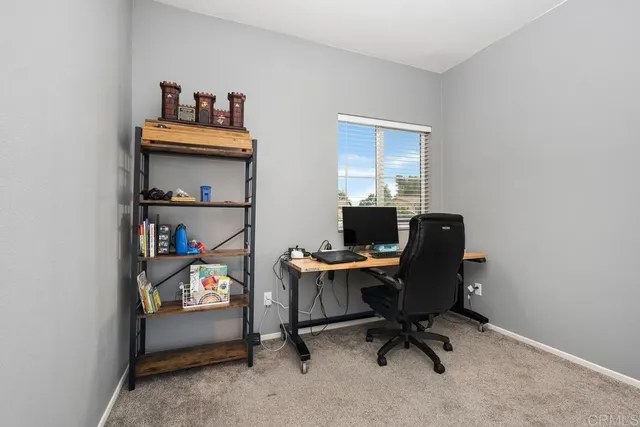 a view of a workspace with furniture