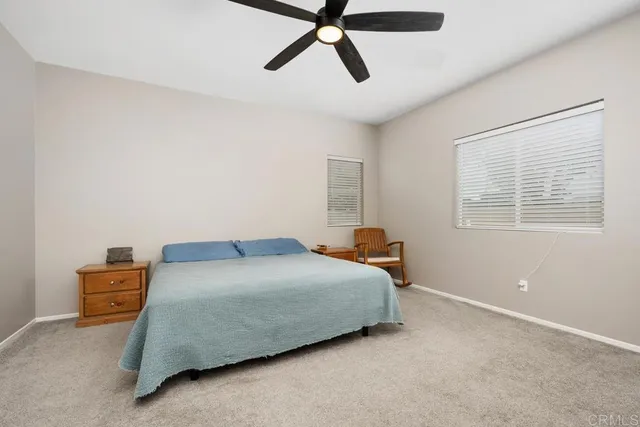a bedroom with a bed and cabinets