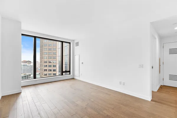 a bathroom with a toilet a sink and a mirror