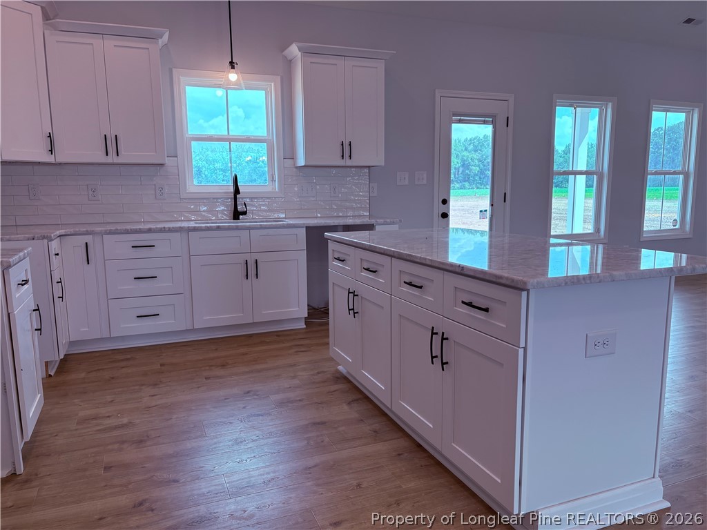 1075 Purdie-Hall Road Tar Heel, NC 28392 - Photo 6 of 28 a kitchen with stainless steel appliances sink cabinets and window