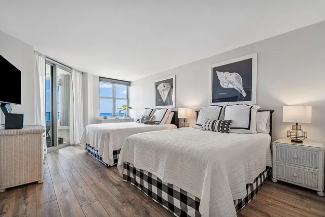 a room with a bed a couch and a window