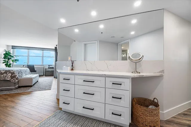 a spacious bathroom with a double vanity sink and a mirror
