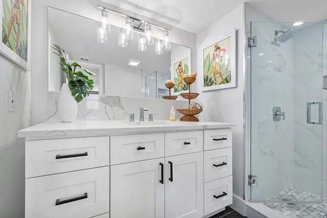 a bathroom with a sink a vanity and a mirror
