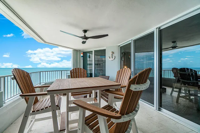 a view of a dining room with furniture window and outside view