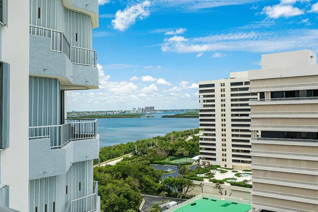 a view of a patio with table and chairs and potted plants