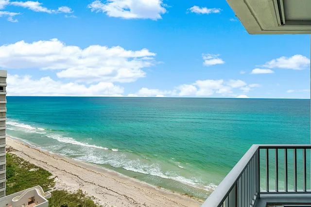 a view of a balcony with an ocean view