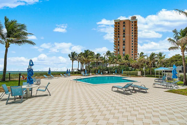 a view of a swimming pool with a lounge chairs
