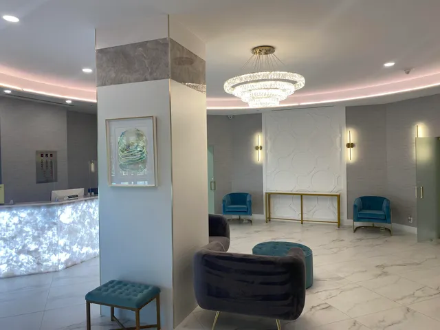 a view of living room with furniture and a chandelier