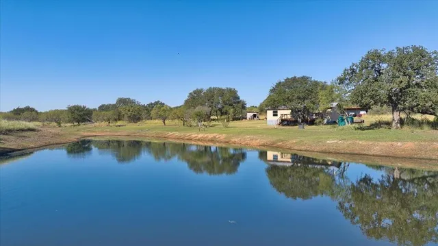a view of lake with green space