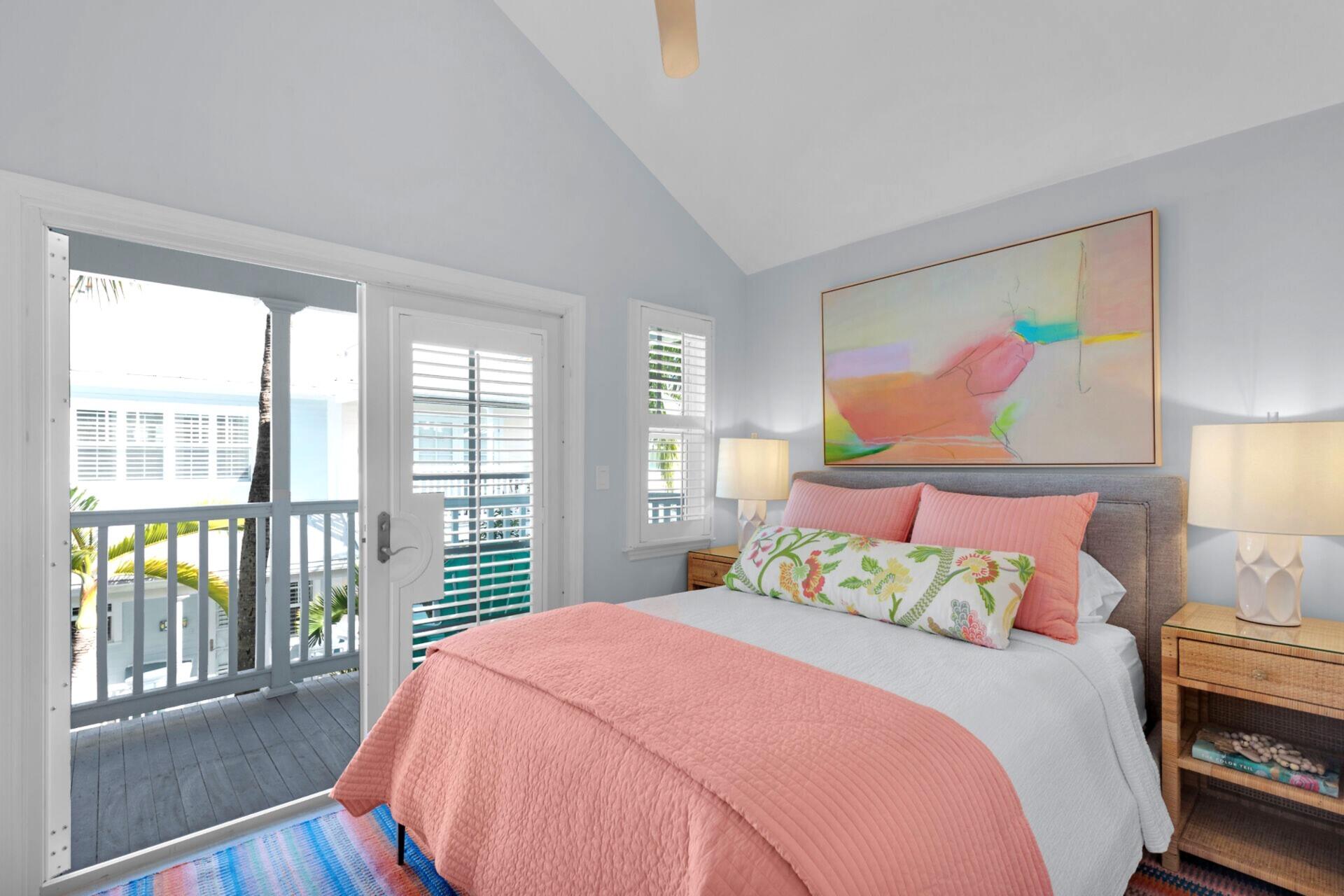 528 Porter Lane Key West, FL 33040 - Photo 14 of 27 a bedroom with a large bed and a large window