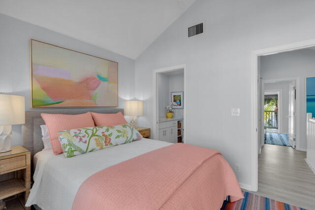 528 Porter Lane Key West, FL 33040 - Photo 15 of 27 a bedroom with a bed and a painting on the wall